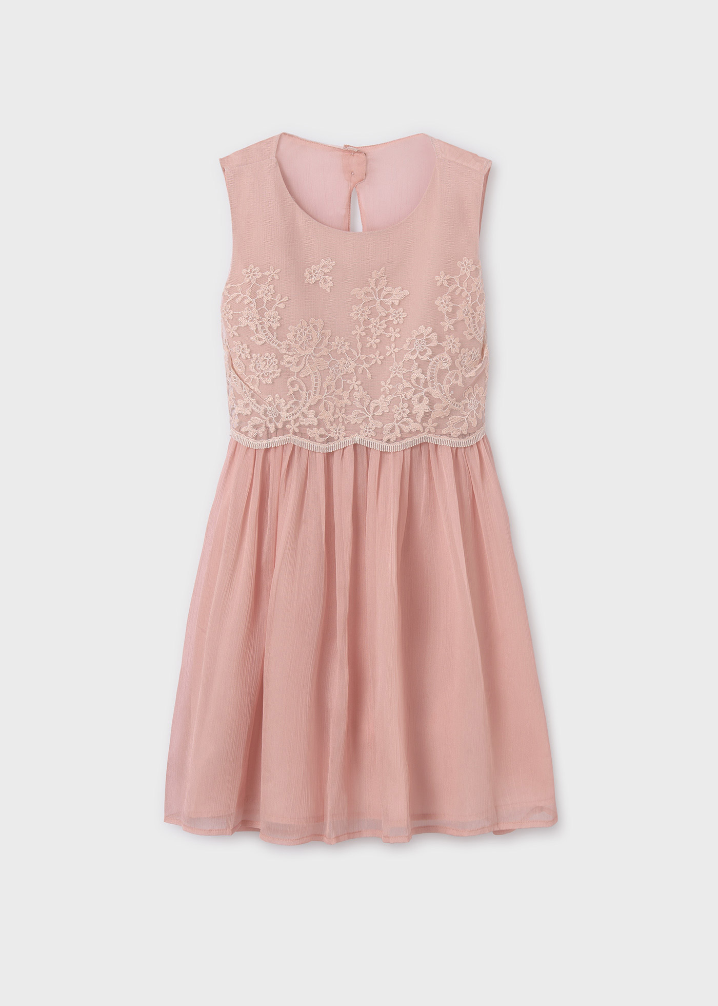 Vestido bordado, combinado com uma cor crua, para menina.