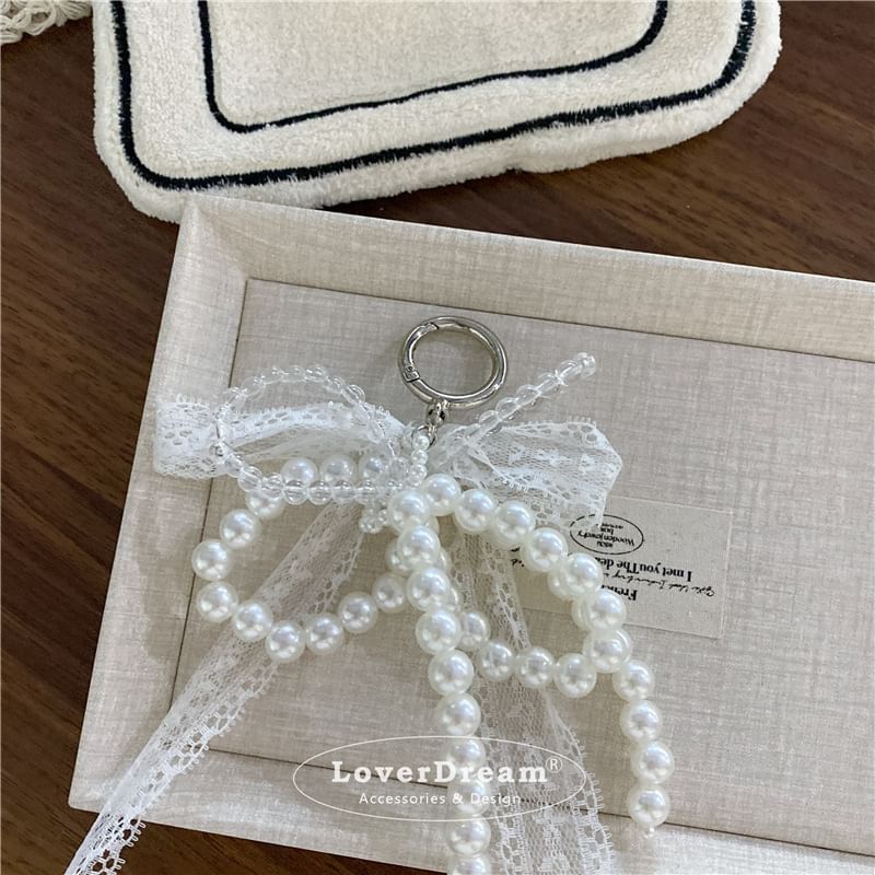 BeDaisy - Sleutelhanger met strik en imitatieparelkant