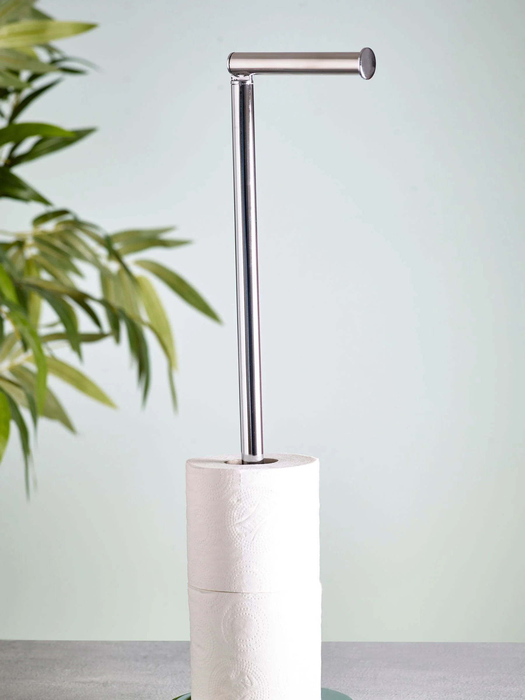 Toiletrolhouder met roterende bovenkant