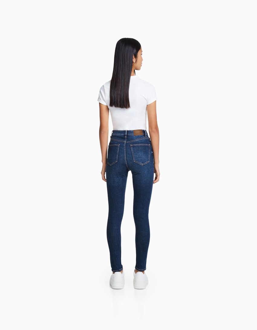 calça jeans skinny de cintura super alta