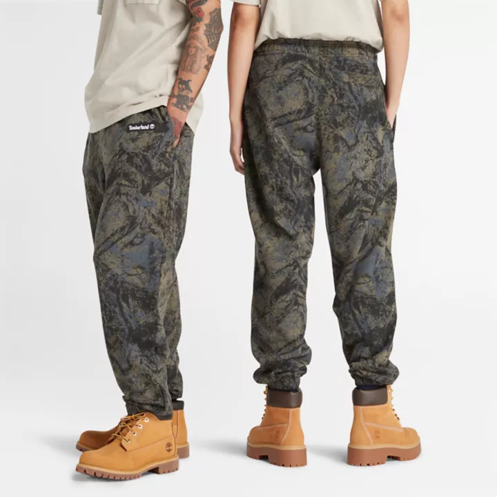 Calça de moletom unissex com estampa camuflada de montanhas.
