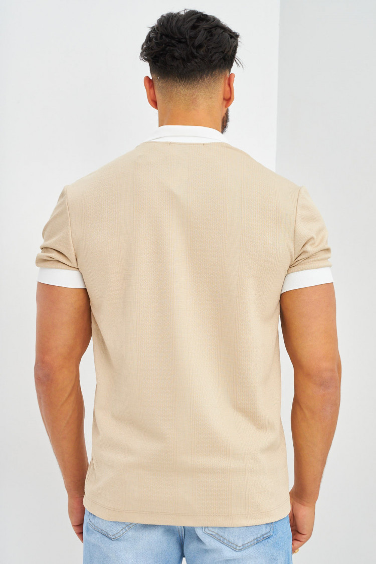 Polo beige à détails blanc