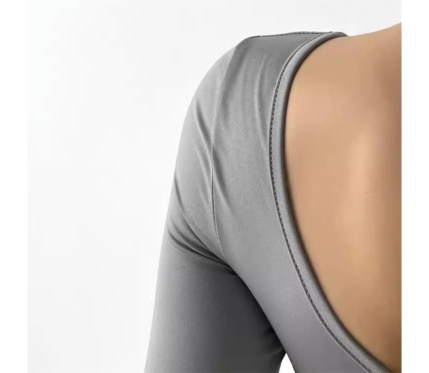 CUCURBIT - Sport T-shirt met lange mouwen en open rug
