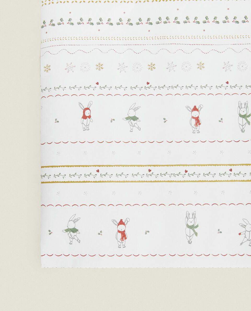 Papel de embrulho infantil com coelhinhos de Natal