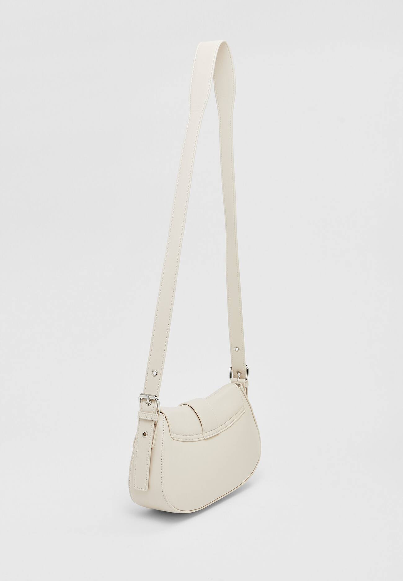 Bolsa transversal com fivela em couro sintético
