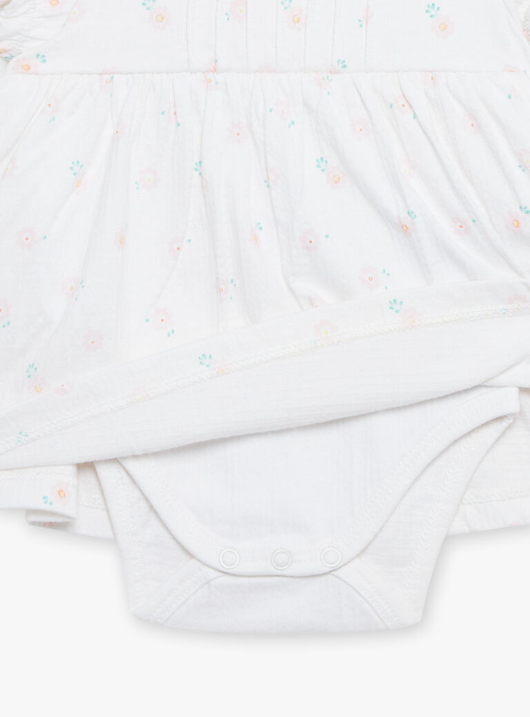 Robe et béguin de naissance blancs à imprimé fleurs