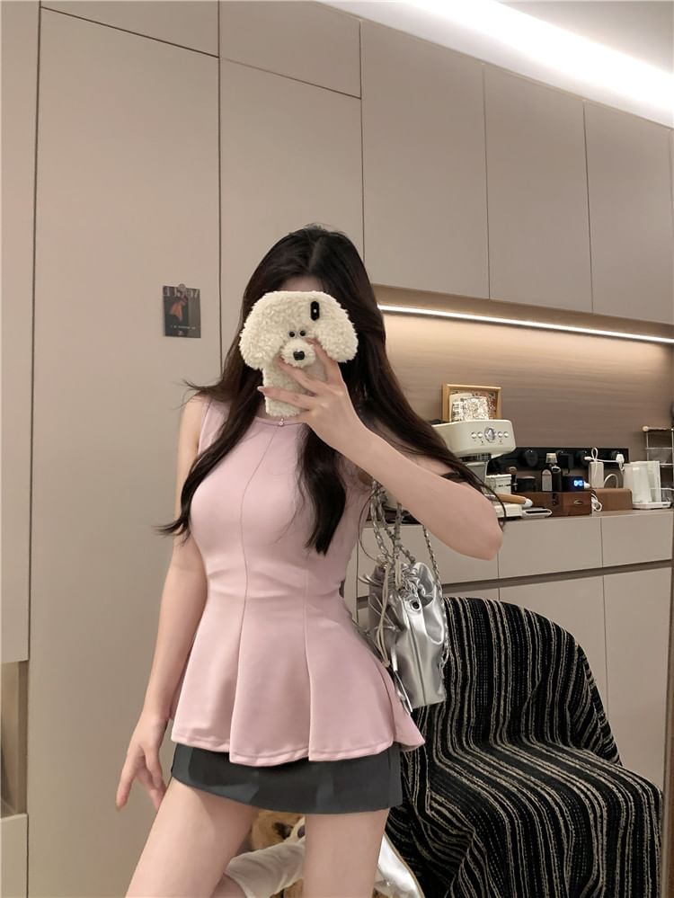 Tel tot 10 - Tanktop met ronde hals en effen peplum