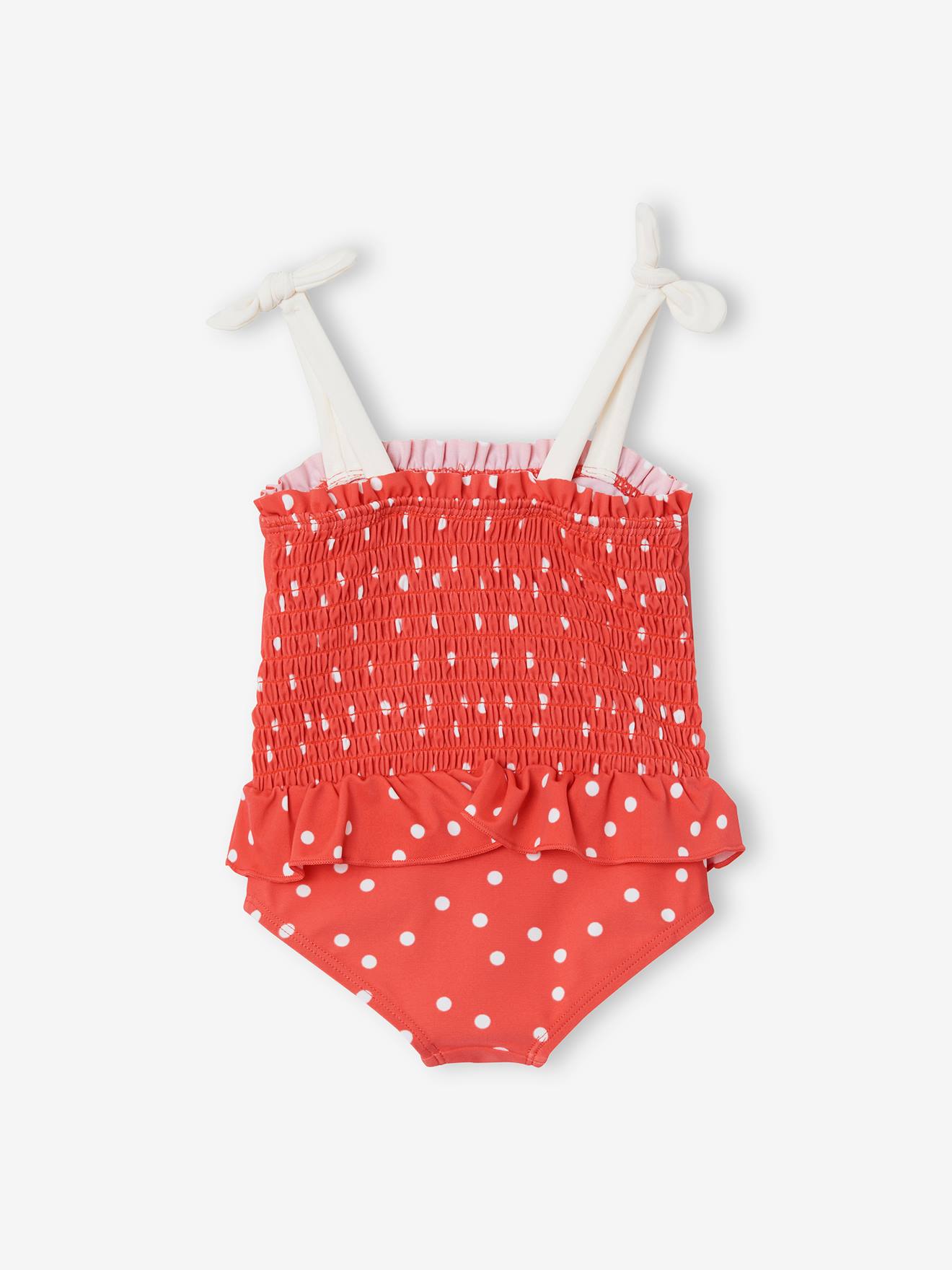Maiô infantil com estampa de bolinhas, tamanho médio, rosa.