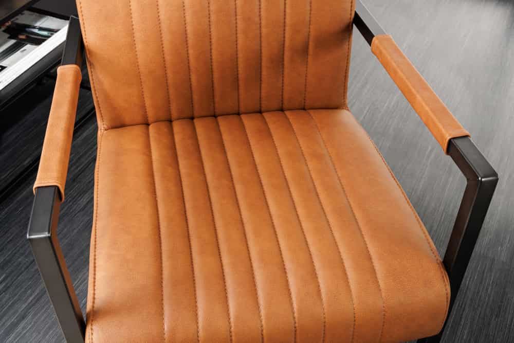 Moderner Freischwinger Stuhl BIG ASTON Echtleder vintage cognac Taschenfederkern Metall