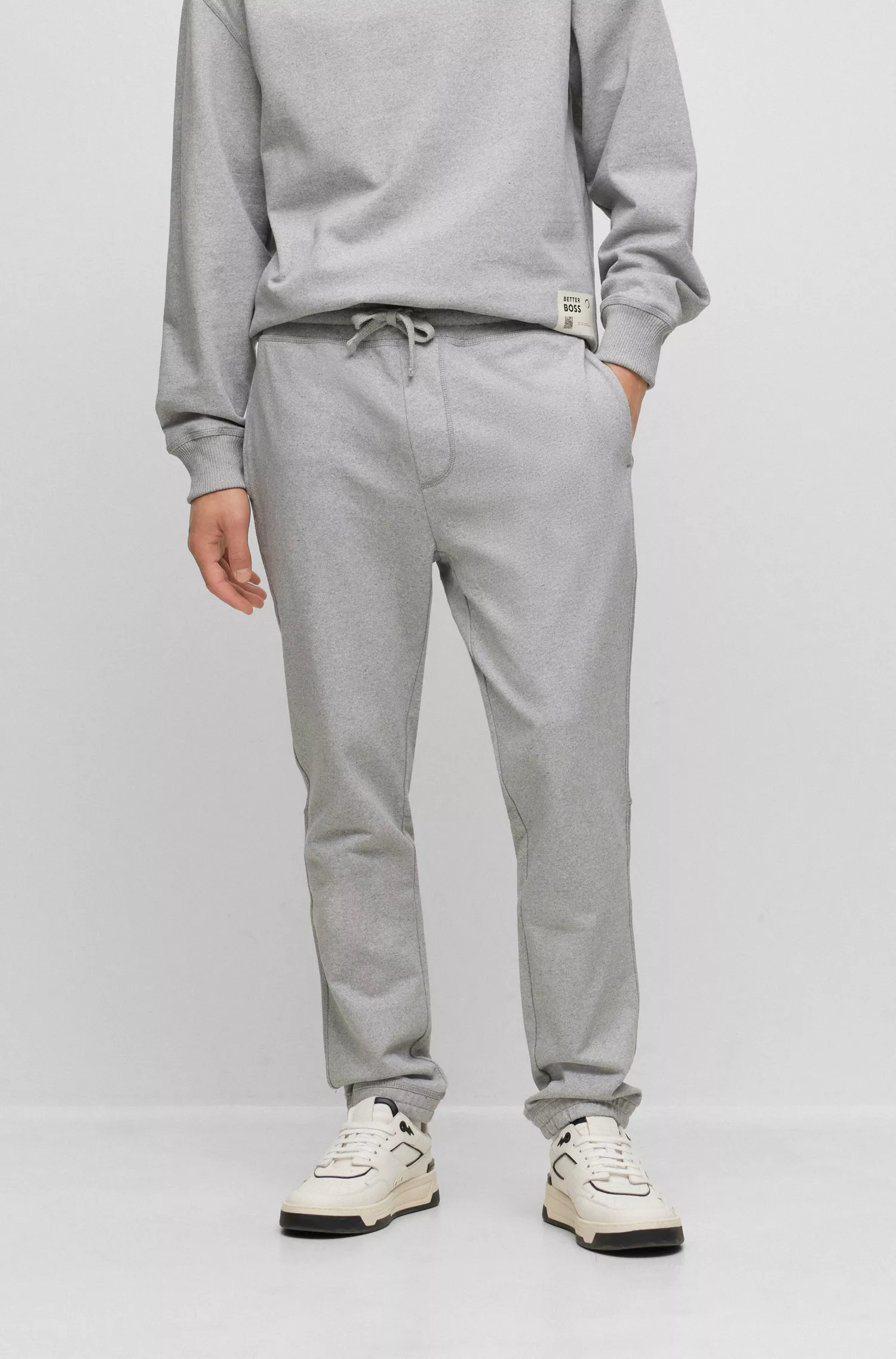Calça de fato de treino BOSS laranja, corte relaxado, em algodão felpudo francês.