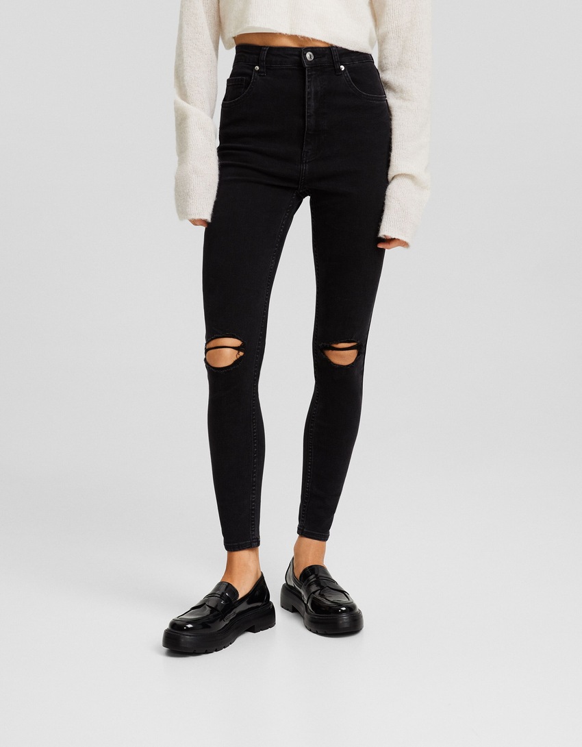 Calça jeans skinny de cintura super alta e rasgada