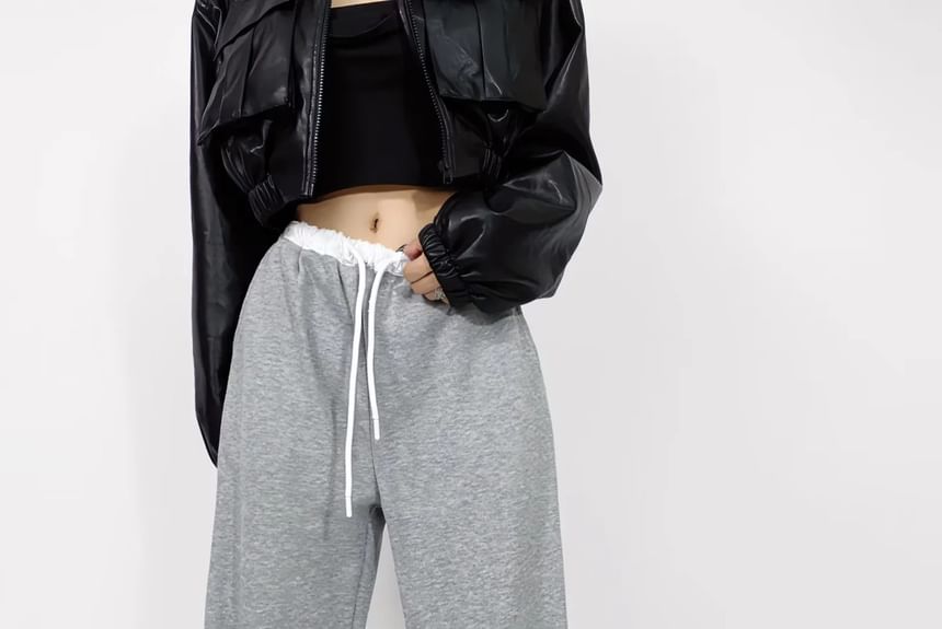 Asiris - Lage, contrasterende, losse joggingbroek met wijde pijpen