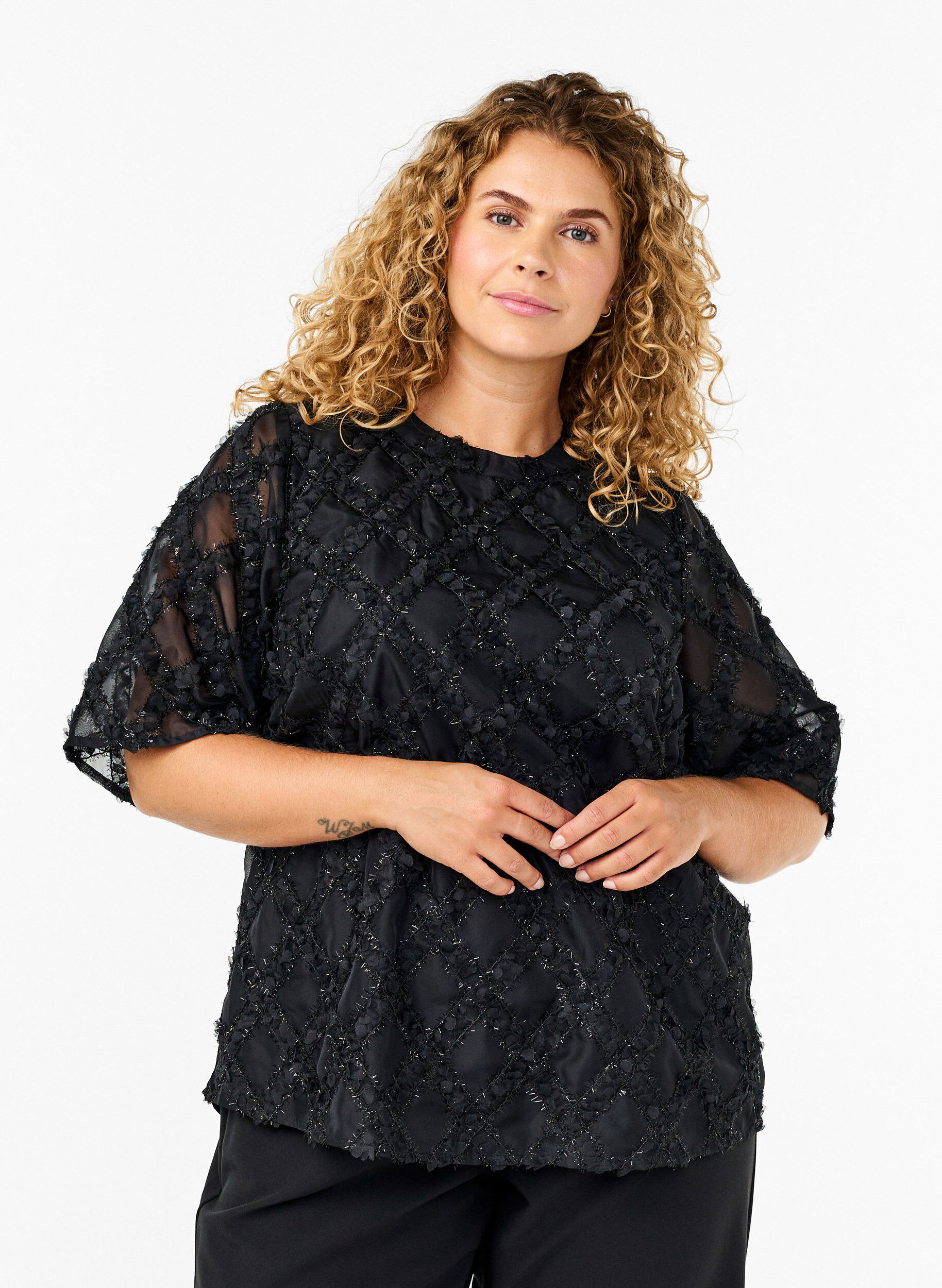 Bluse med harlequin mønster
