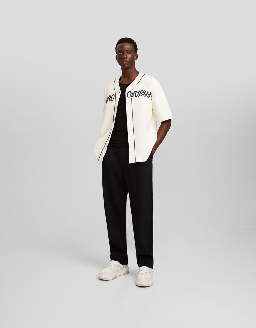 Camisa de beisebol de couro sintético com mangas curtas