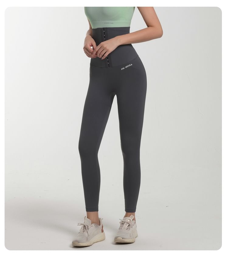 Sishan - Sportlegging met taillevormende letters