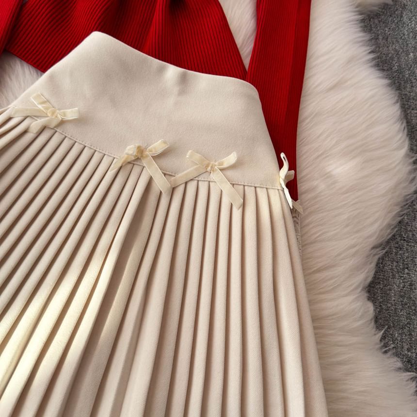 Yearnin - Set: lange mouwen, effen gebreide top met lintaccent + hoge taille mini-plooirok