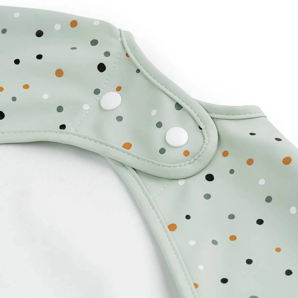 Sleeved pocket bib Happy dots Green