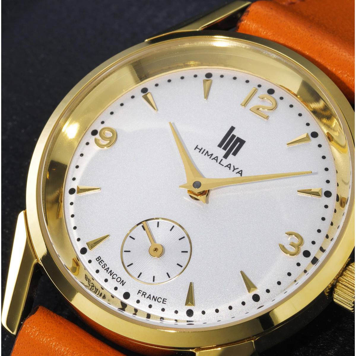 Montre Lip femme acier doré bracelet cuir orange