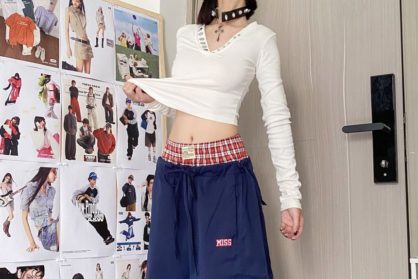 MELLO - Wijde broek met middelhoge taille en geruit paneel en letters