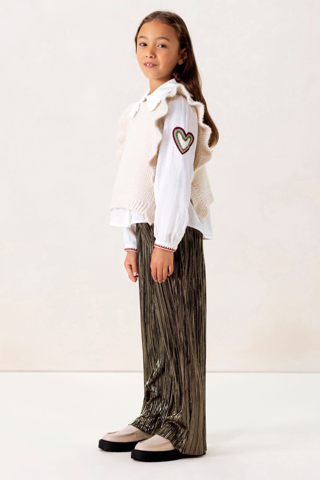 Witte gebreide spencer met ruffles