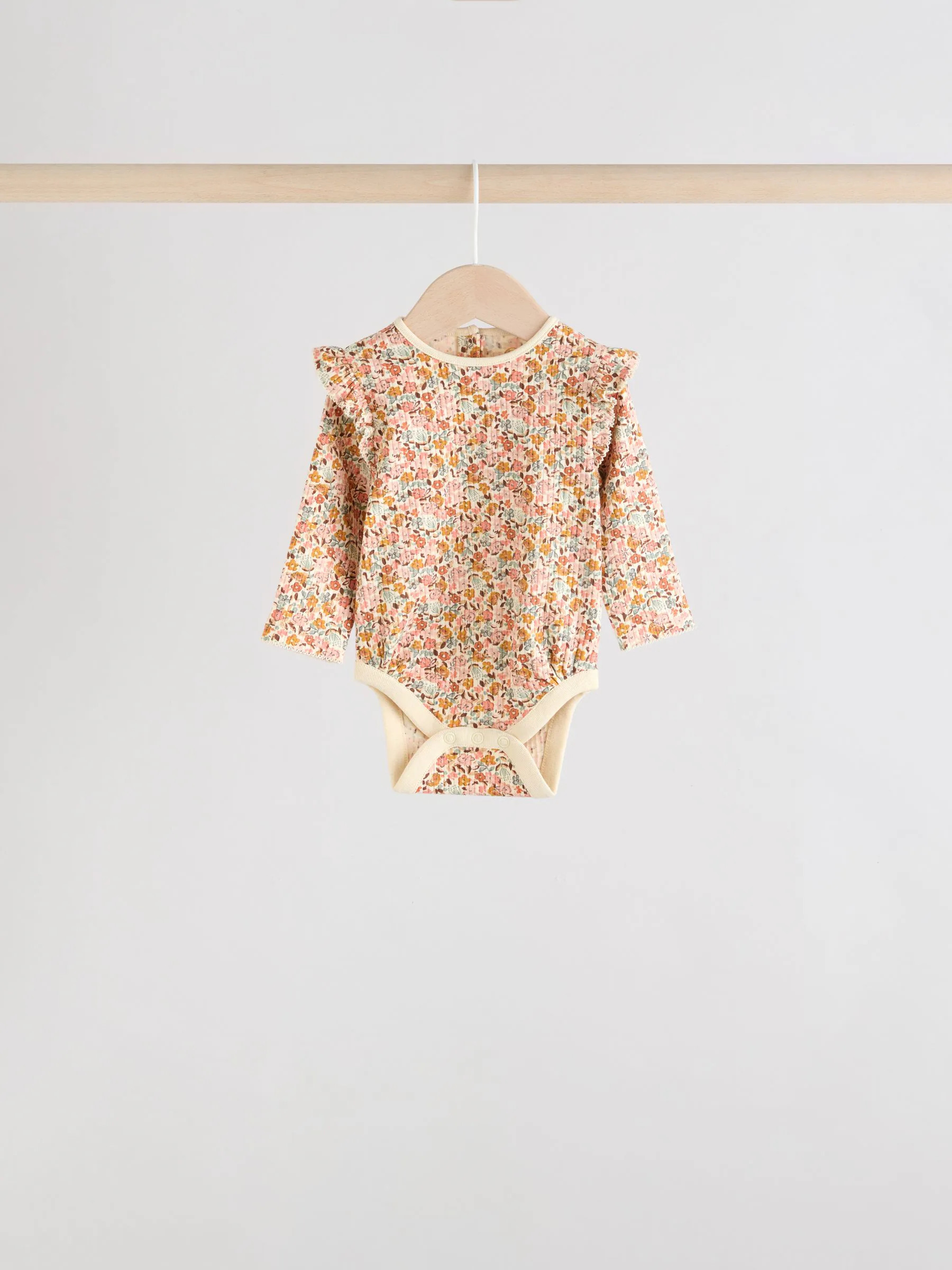 Blauw/crème/koraal Ditsy - Verpakking van 4 babyrompers met lange mouwen en ruches (0mnd-2jr)