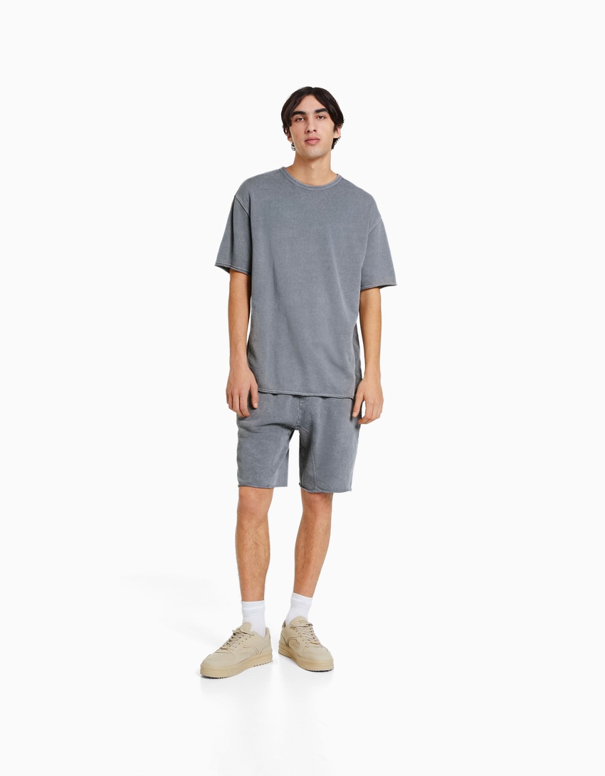 Bermudas de pelúcia com efeito desbotado