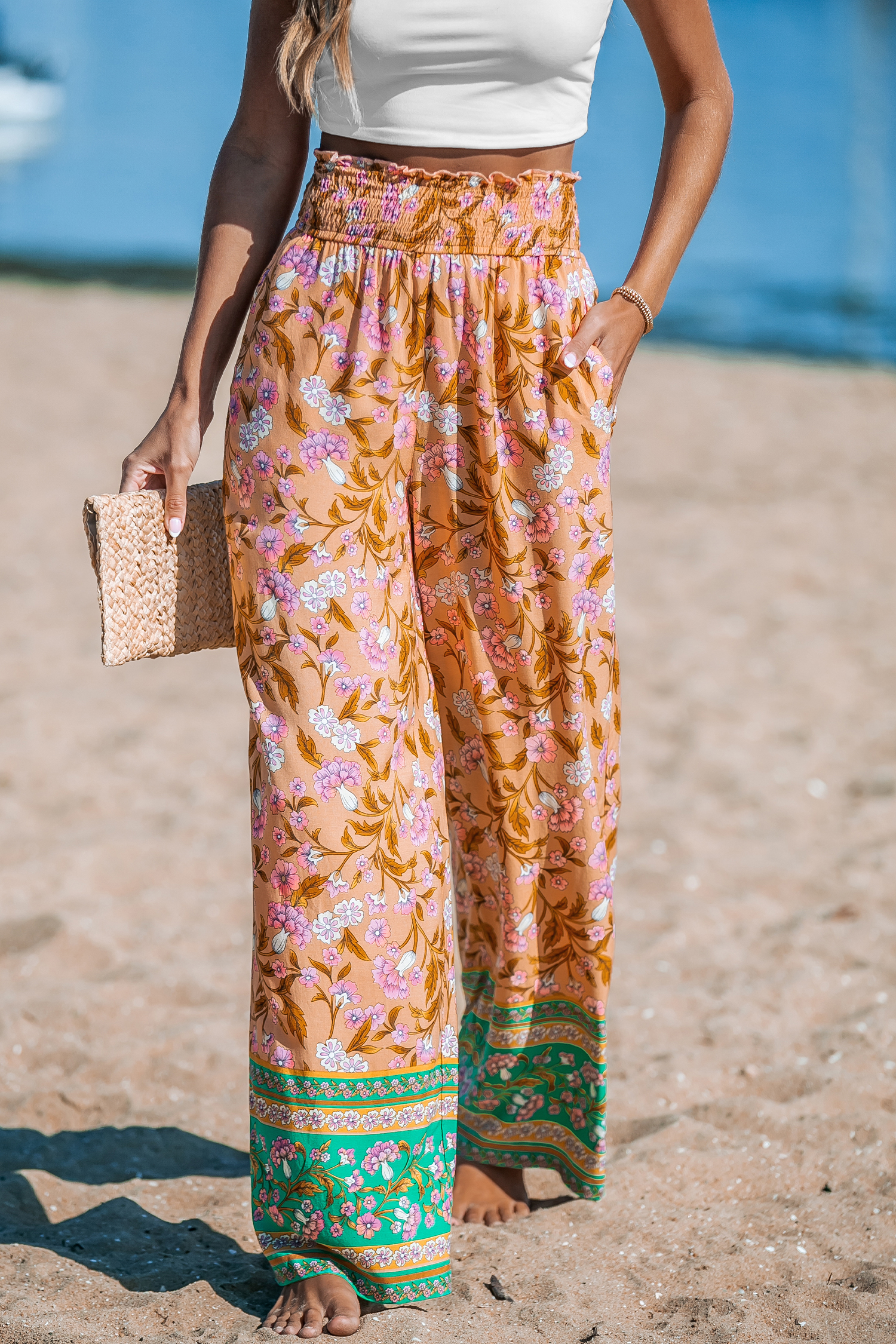 Pantalon fleuri avec jambes droites et taille à smocks orange