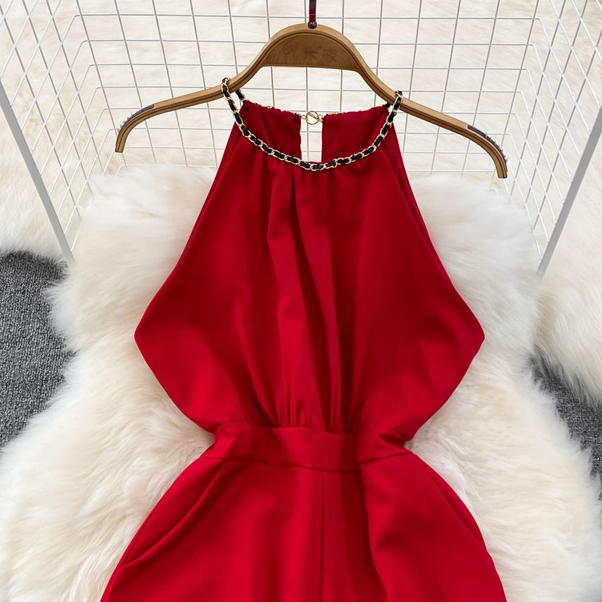 Yearnin - Mouwloze halter romper met wijde pijpen