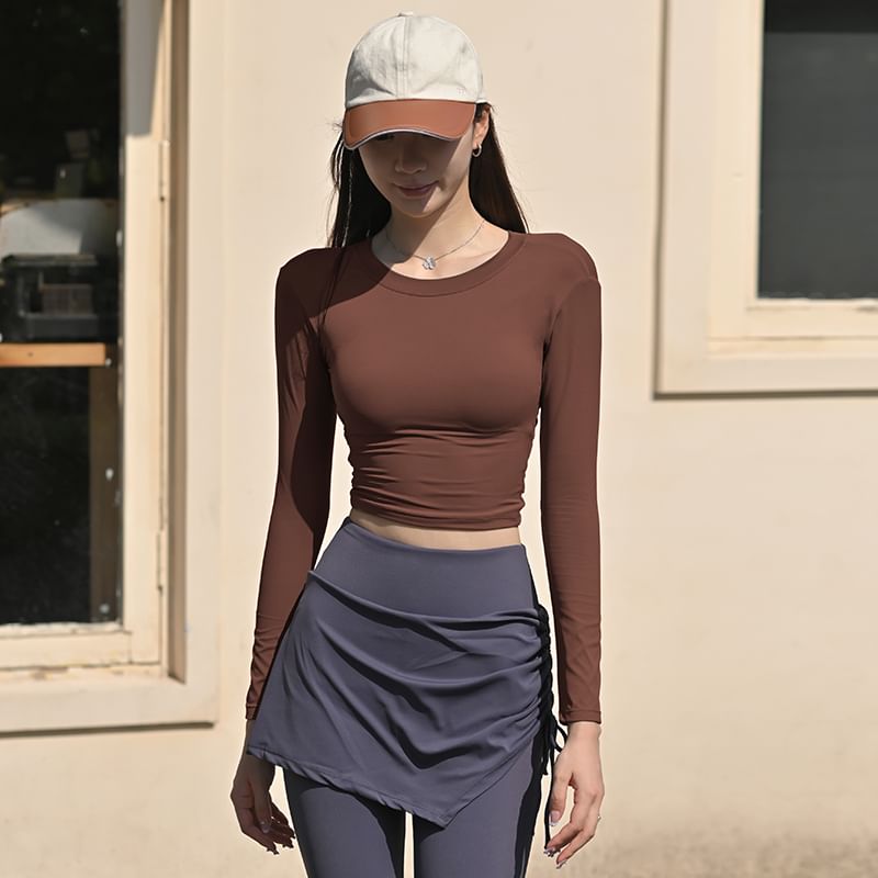 Faiar - Lange mouwen ronde hals effen uitgesneden rug gewatteerd crop sport T-shirt