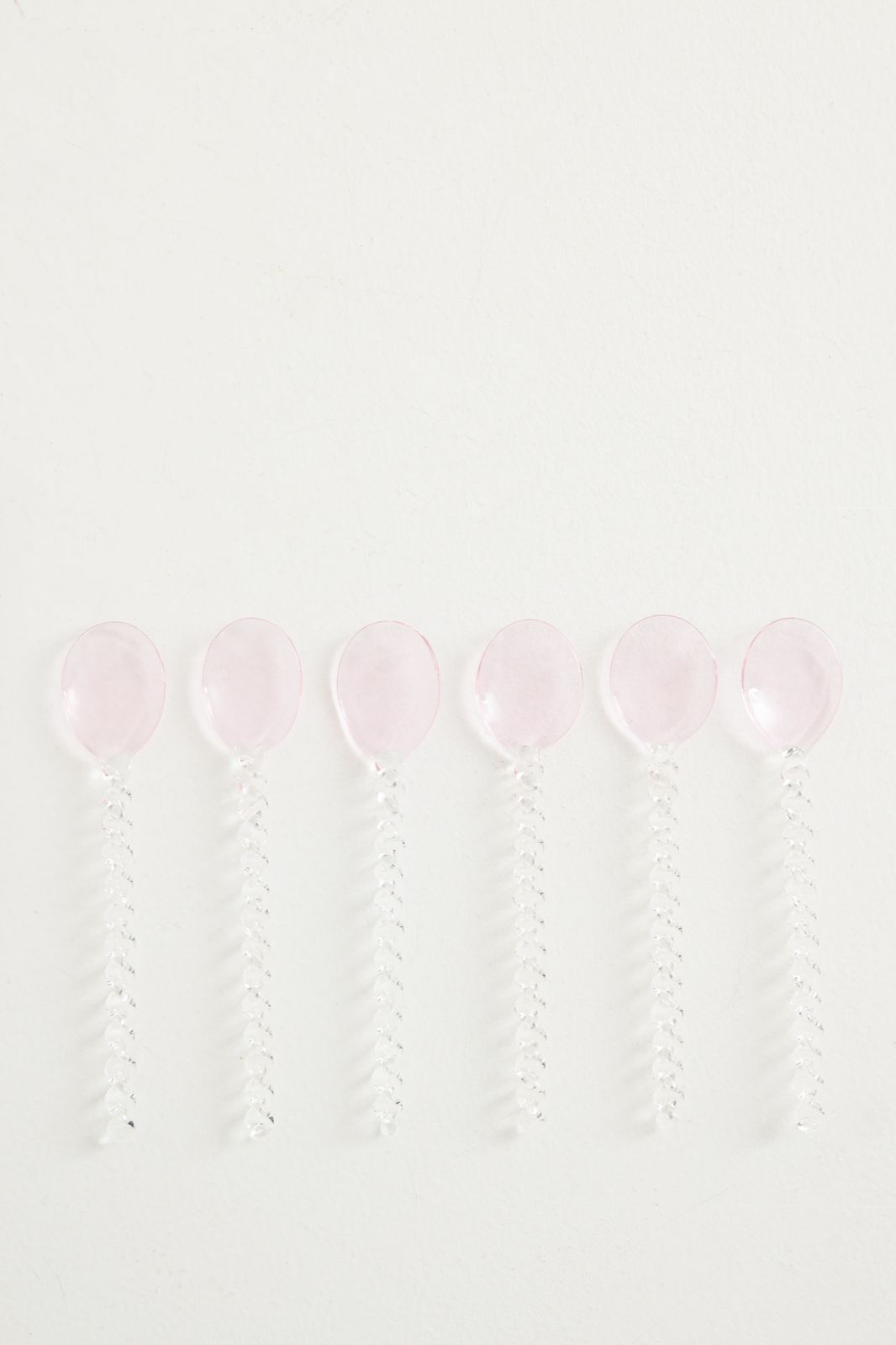 Roze glazen lepel twisted
