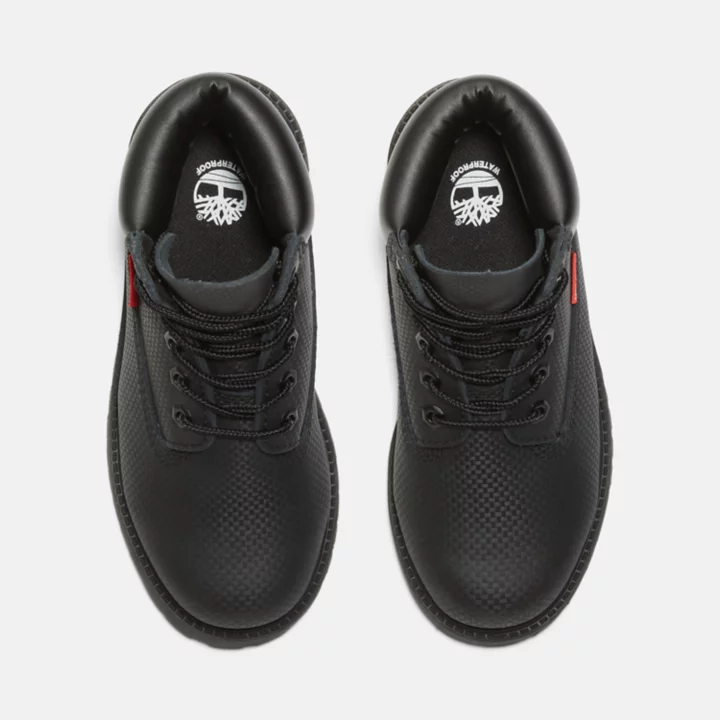 Bota Timberland Premium Helcor de 6 polegadas para jovens na cor preta.