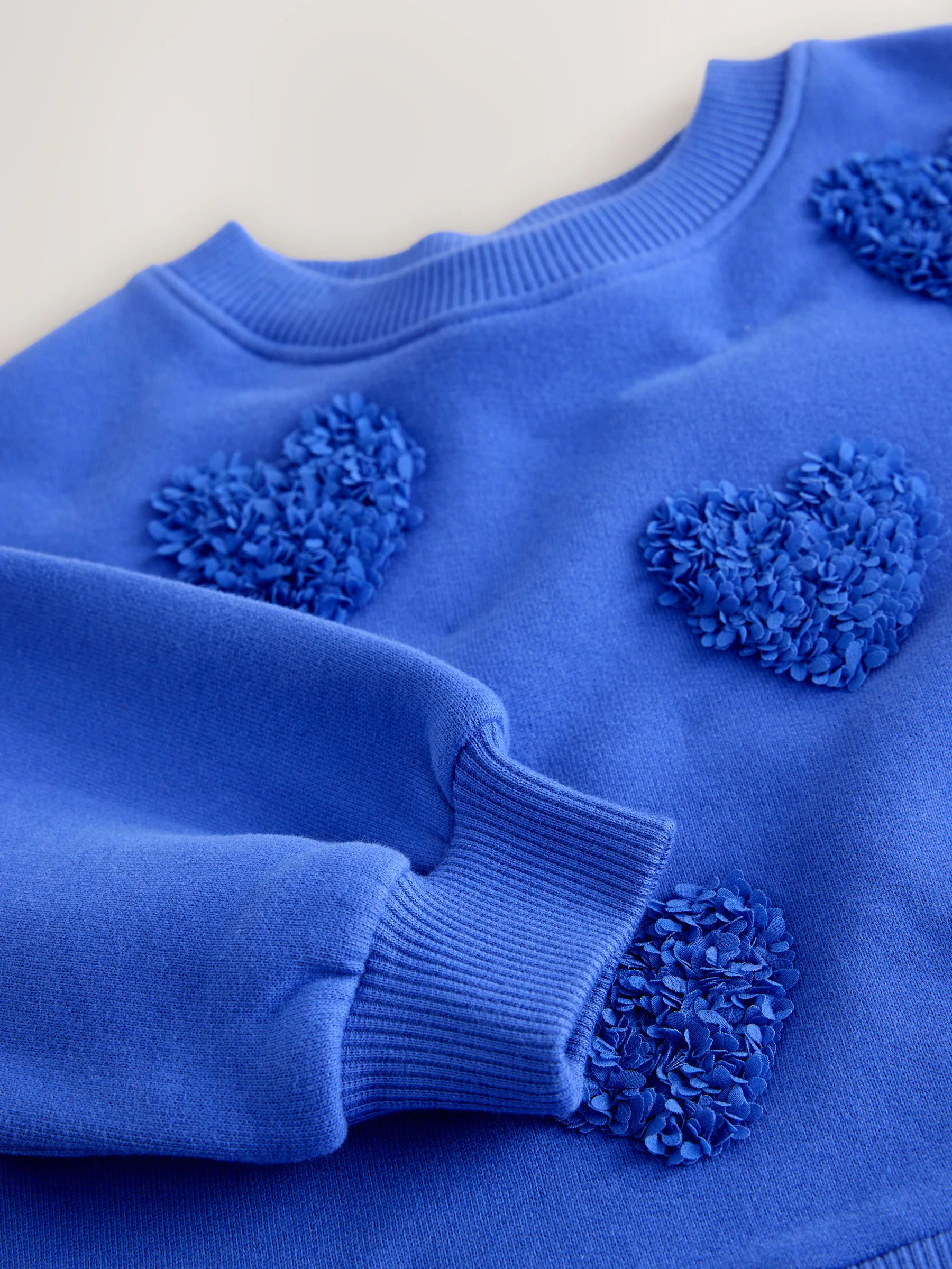 Blauwe hartjes - Feestjurk van sweaterstof (3 mnd-7 jr)