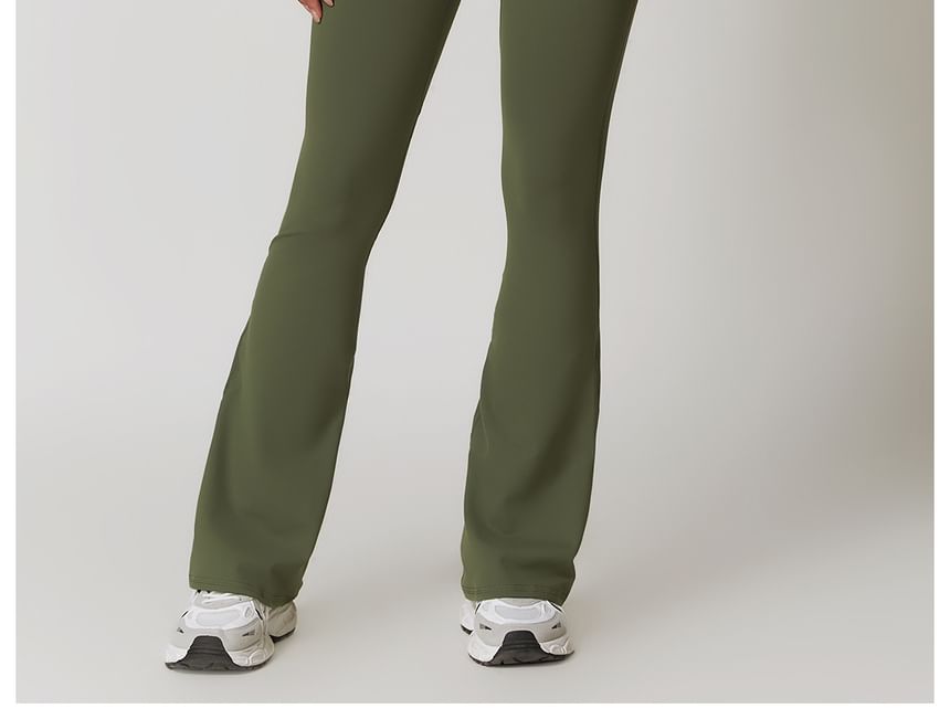 Skinniano - Mouwloze ronde hals, effen open rug, uitlopende sportjumpsuit