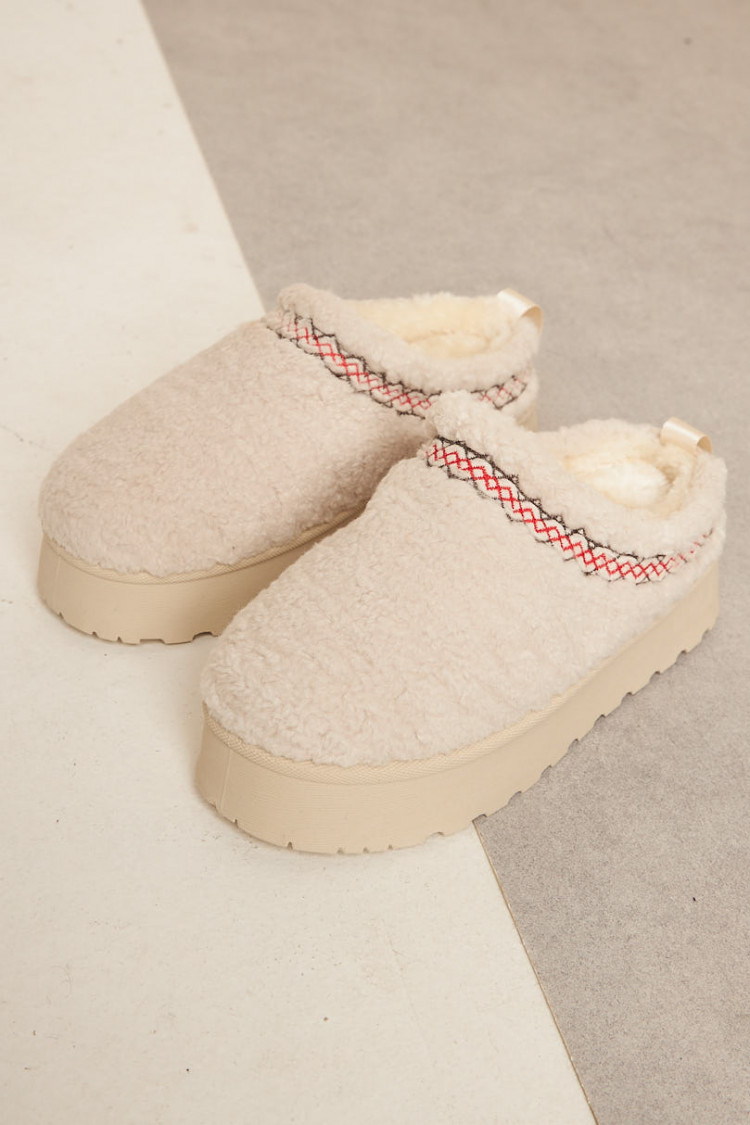 Bottines chaussons en peau de mouton compensés beige