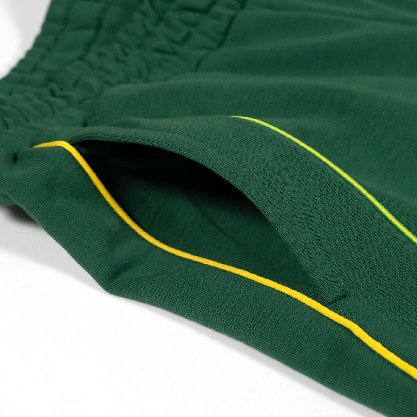 PUMA King Pelé Joggingbroek Donkergroen Geel
