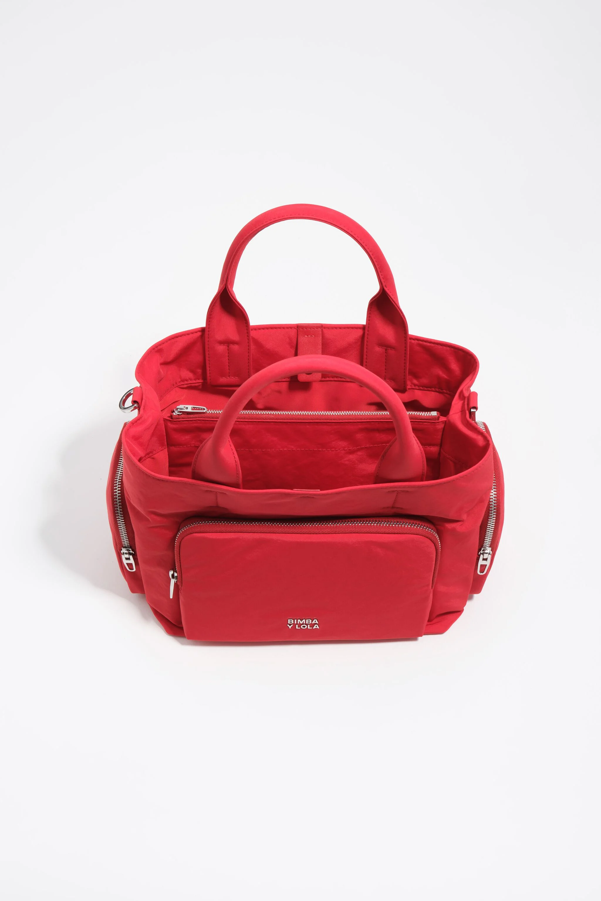 Bolsa transversal grande de nylon vermelha com bolsos.