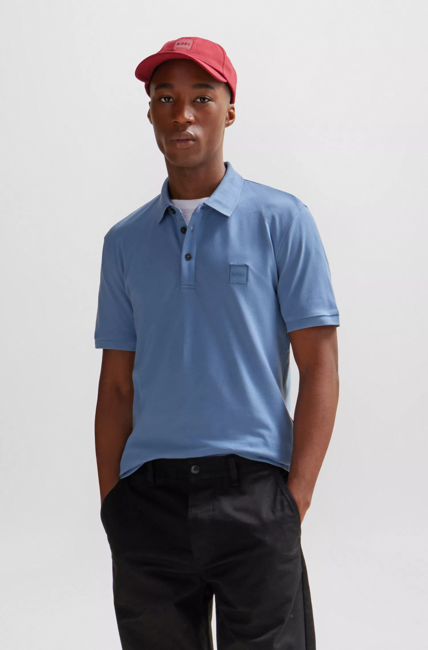 Camisa polo BOSS laranja, de algodão stretch, corte slim, com etiqueta de logotipo.