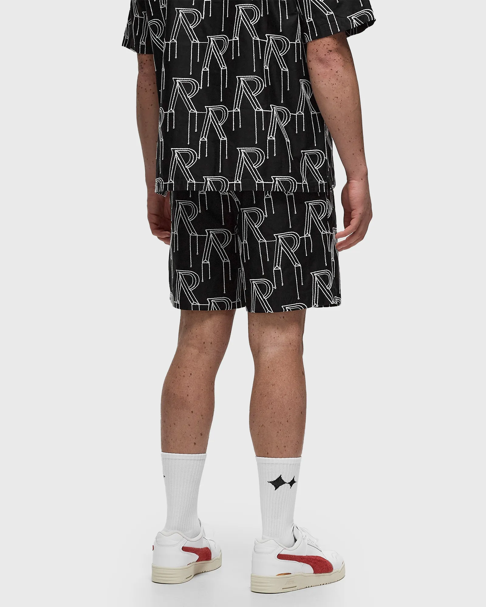 Represent EMBRODIERED INITIAL TAILORED SHORT