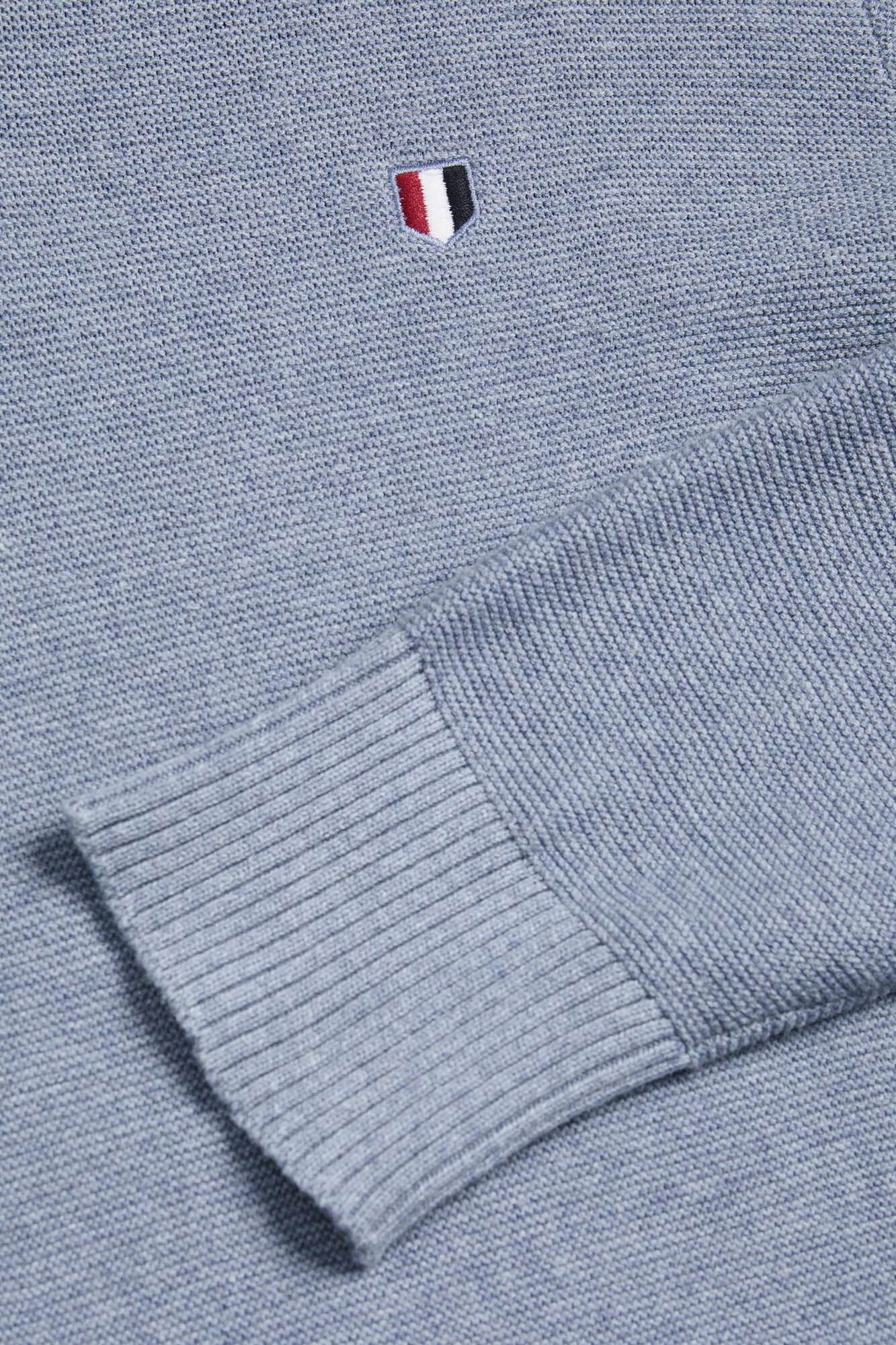 Camisa estruturada em malha com gola alta e fecho de correr, 100% algodão.