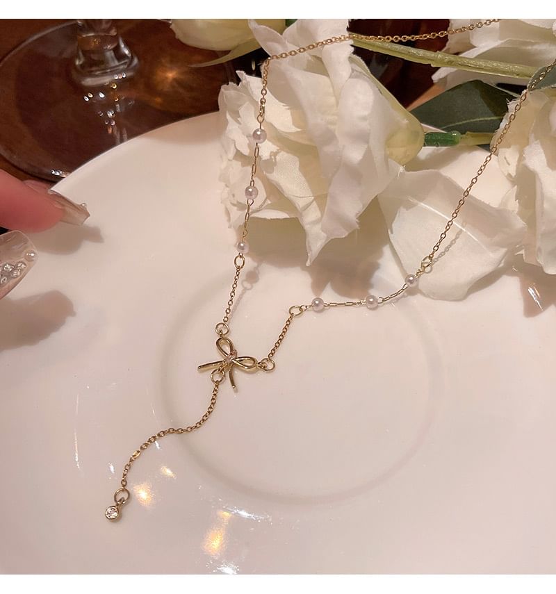 LIVSIA - Ketting met strik en nepparels