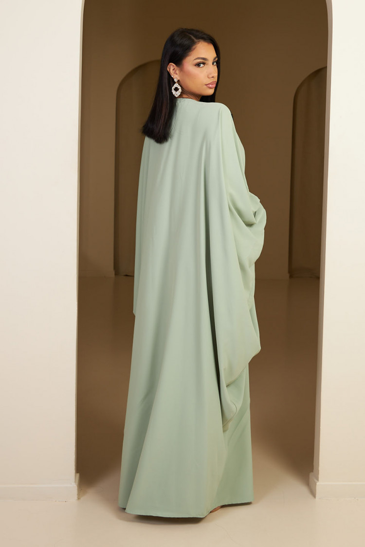 Abaya vert clair à empiècement sequins et pompom noir