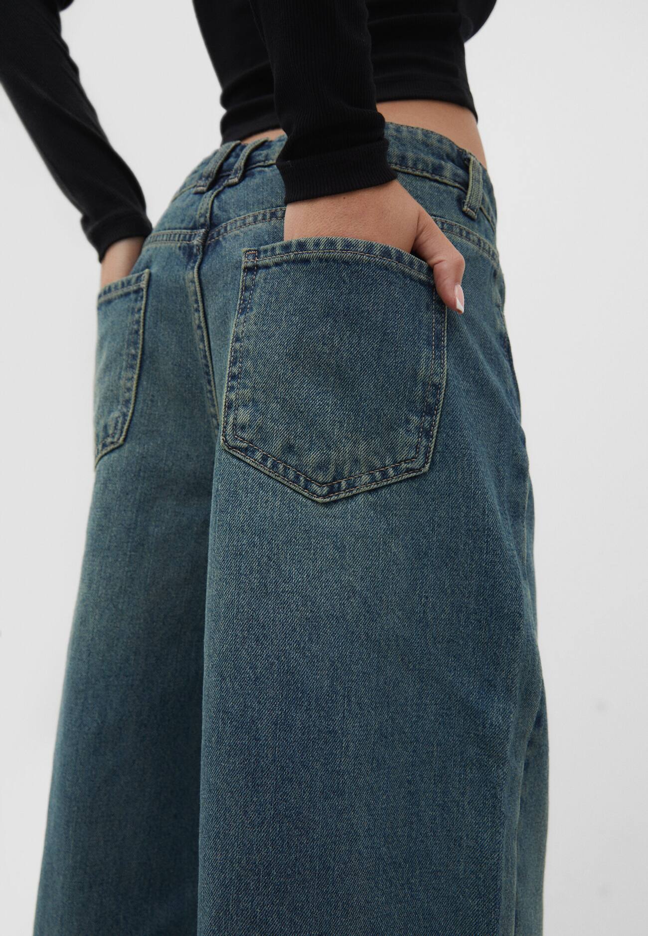 calças jeans de perna larga
