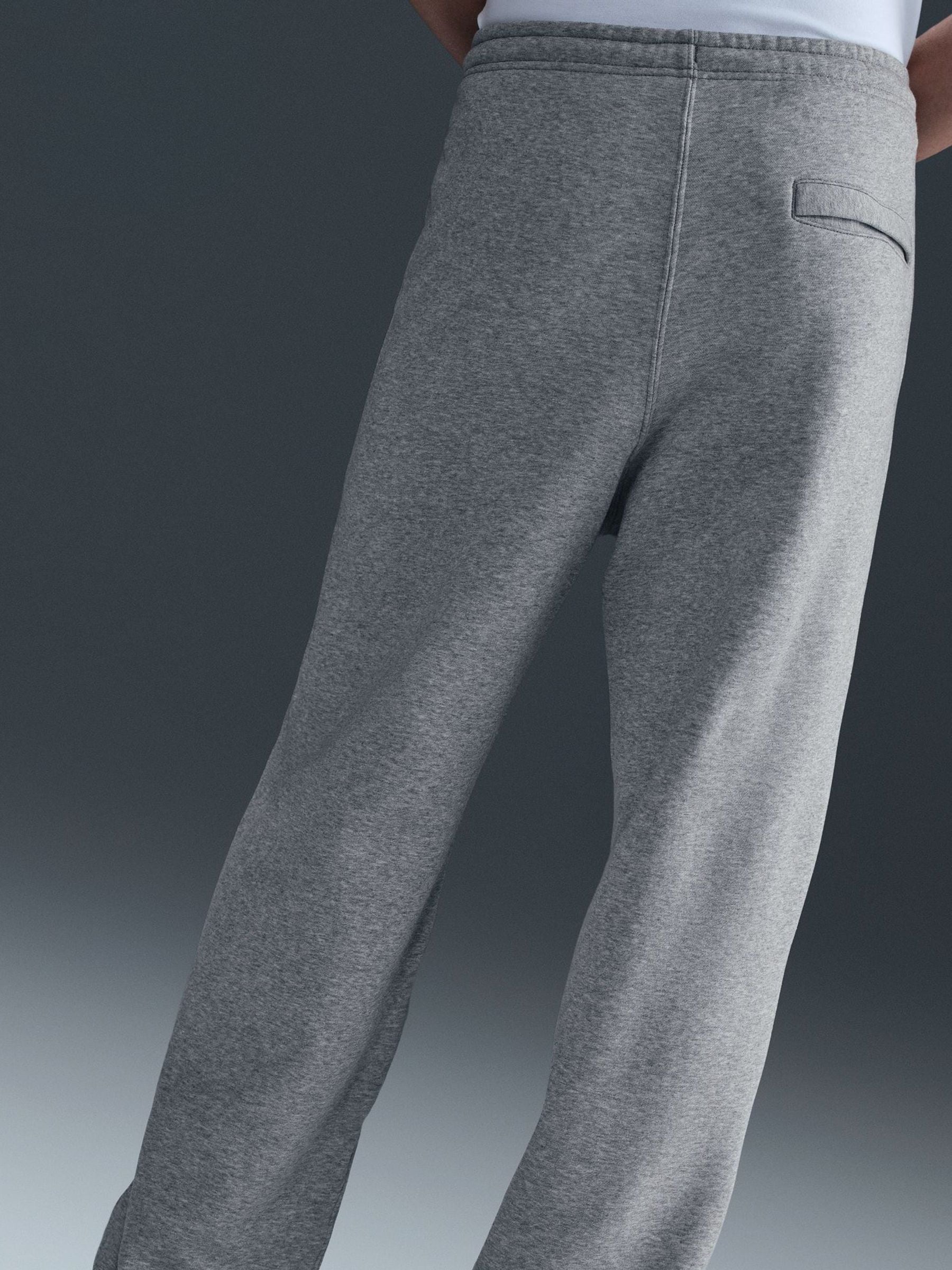 Donkergrijs gemêleerd - Nike Club Fleece joggingbroek met wijde pijpen