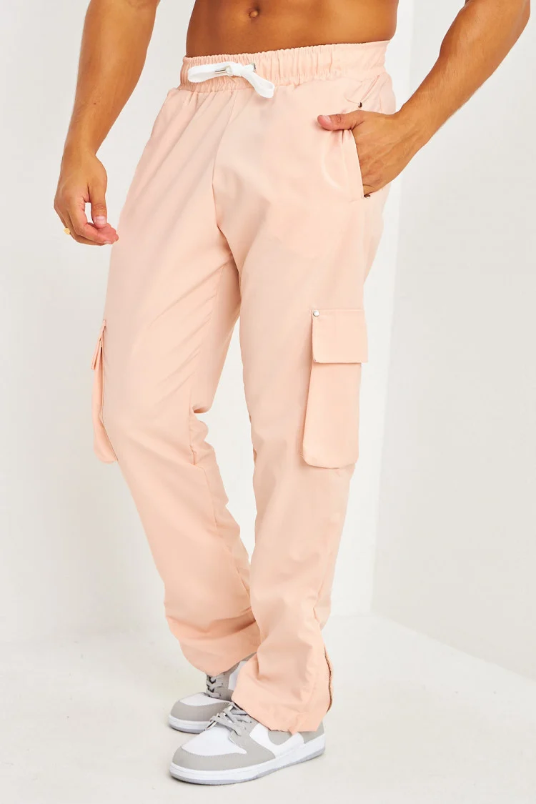 Pantalon de jogging rose poches cargo et zippé aux chevilles