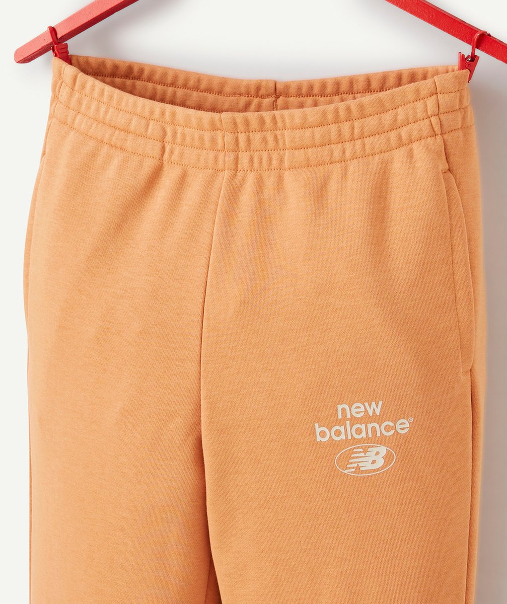 NEW BALANCEJOGGING FILLE ORANGE ESSENTIALS REIMAGINED AVEC LOGO