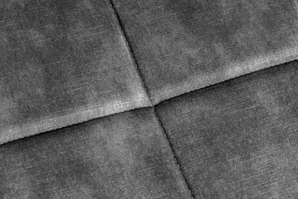 Moderner Hocker SCANDINAVIA grau Samt schwarze Metallbeine Fußhocker