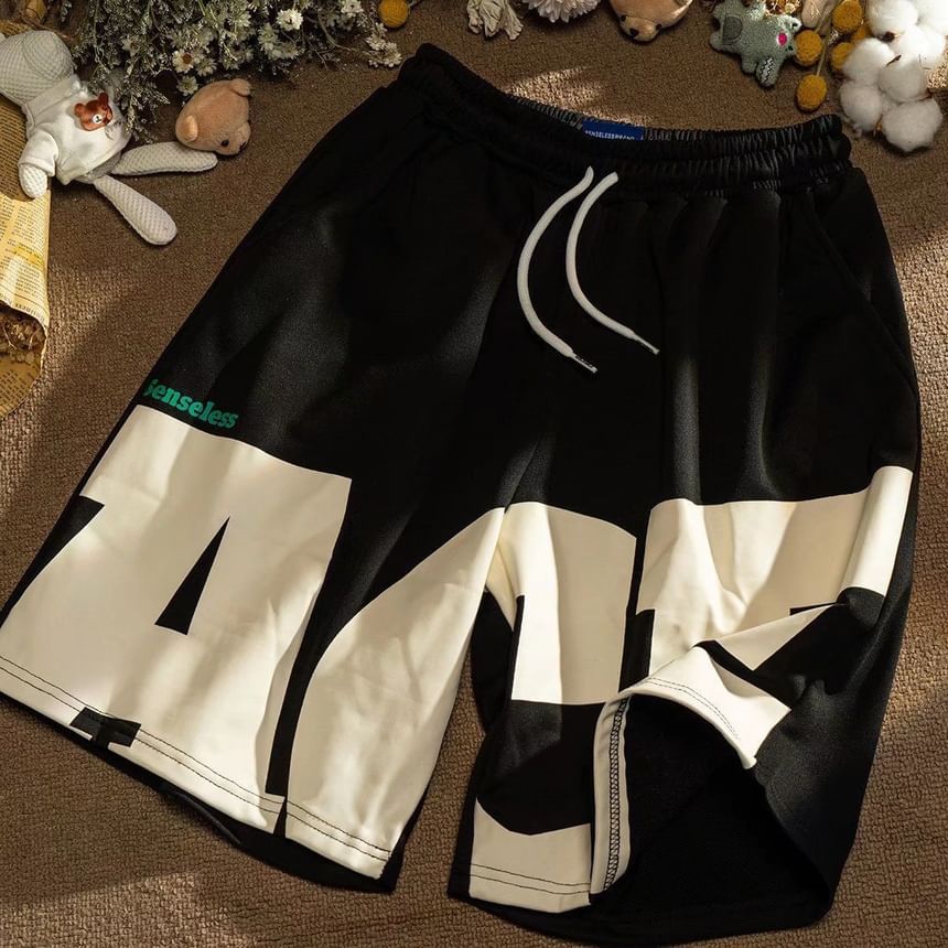 Acrius - Mid Rise Lettering Shorts