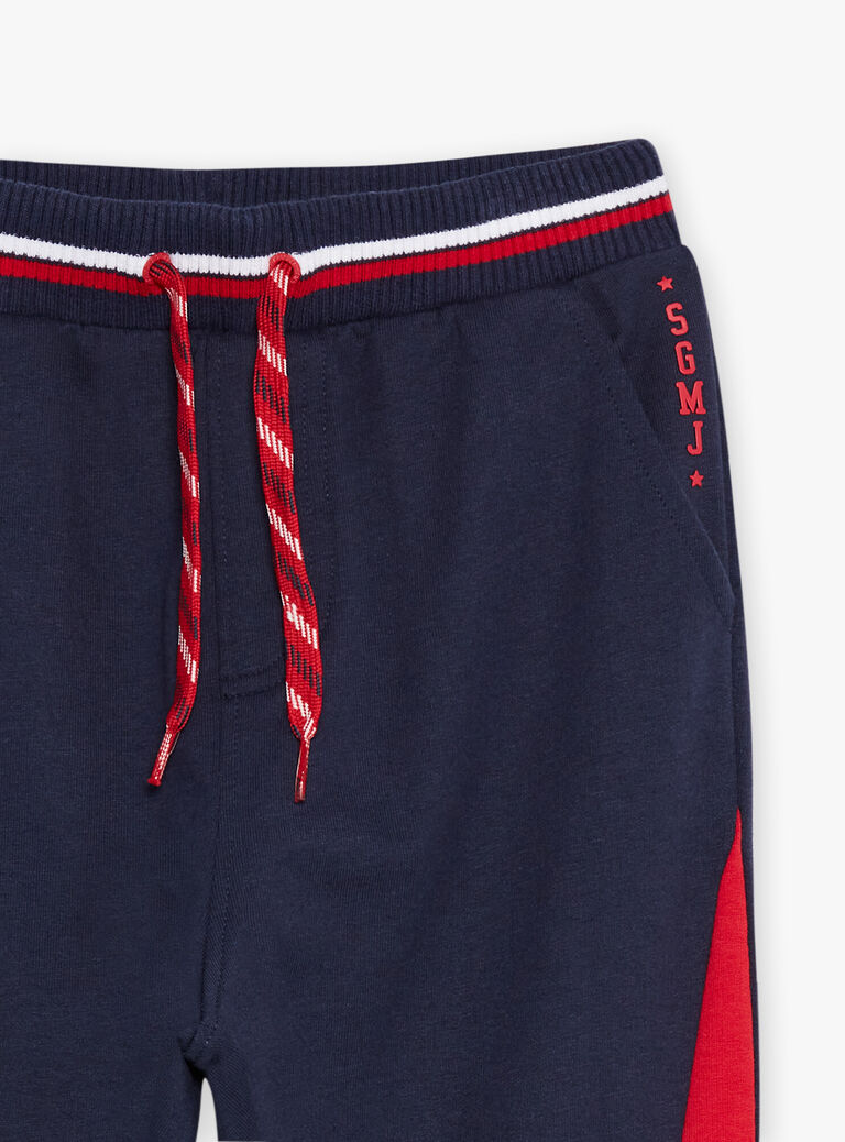 Jogging bleu marine à empiècements rouges