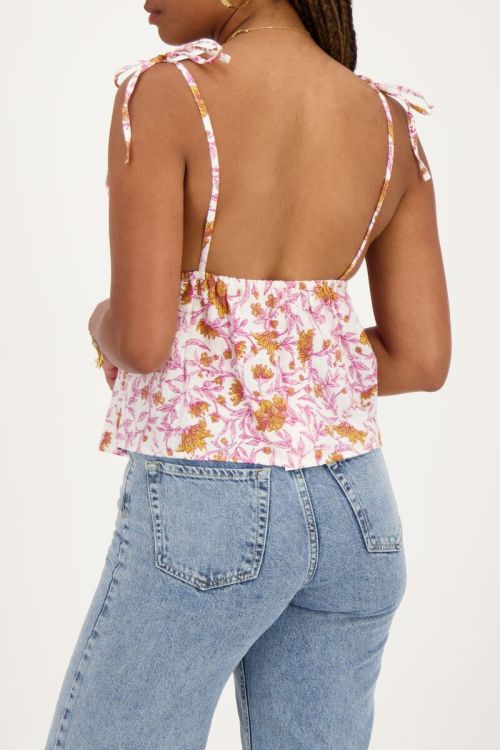 Witte top met roze bloemenprint en strikbandjes