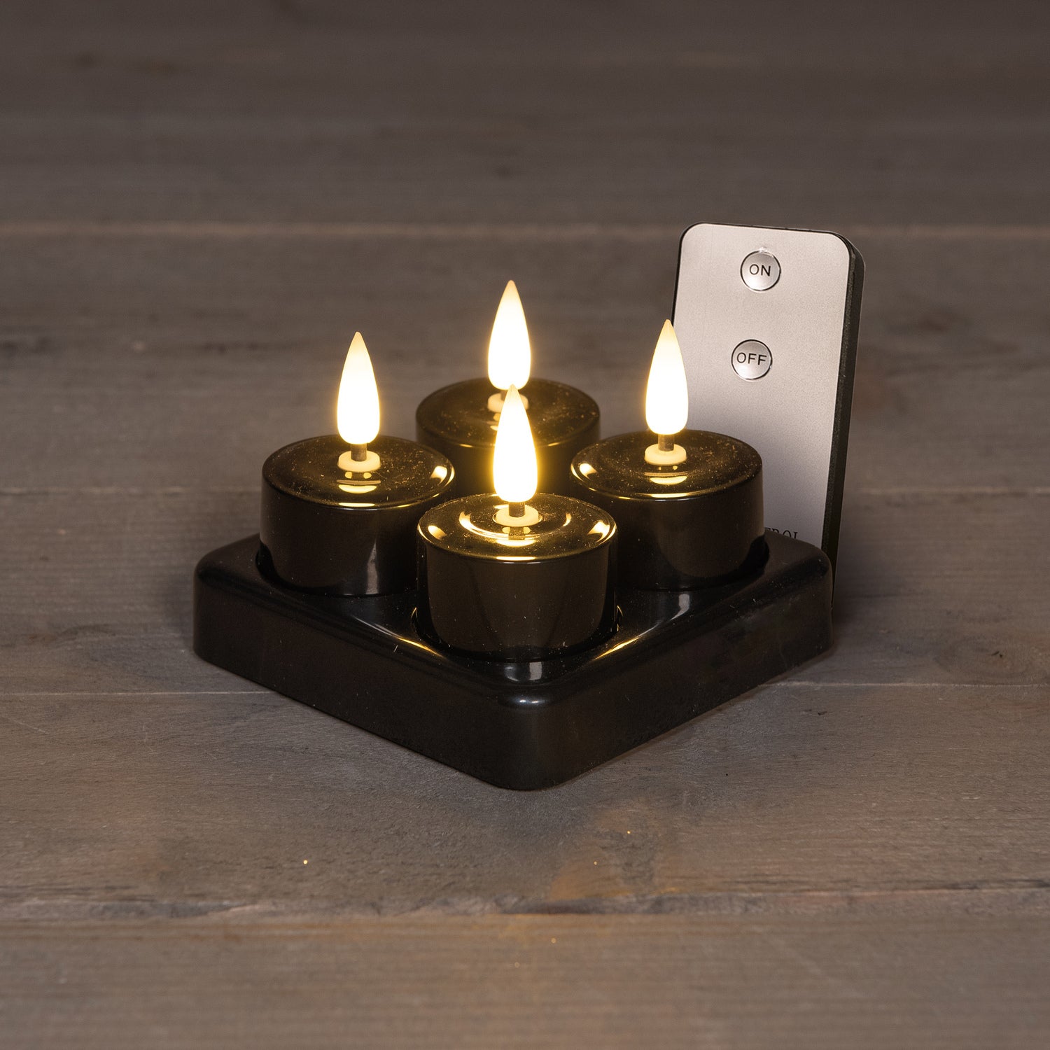Anna's Collection LED waxinelicht met oplaadstation zwart D 3,5 H 1,5 cm 4 stuks